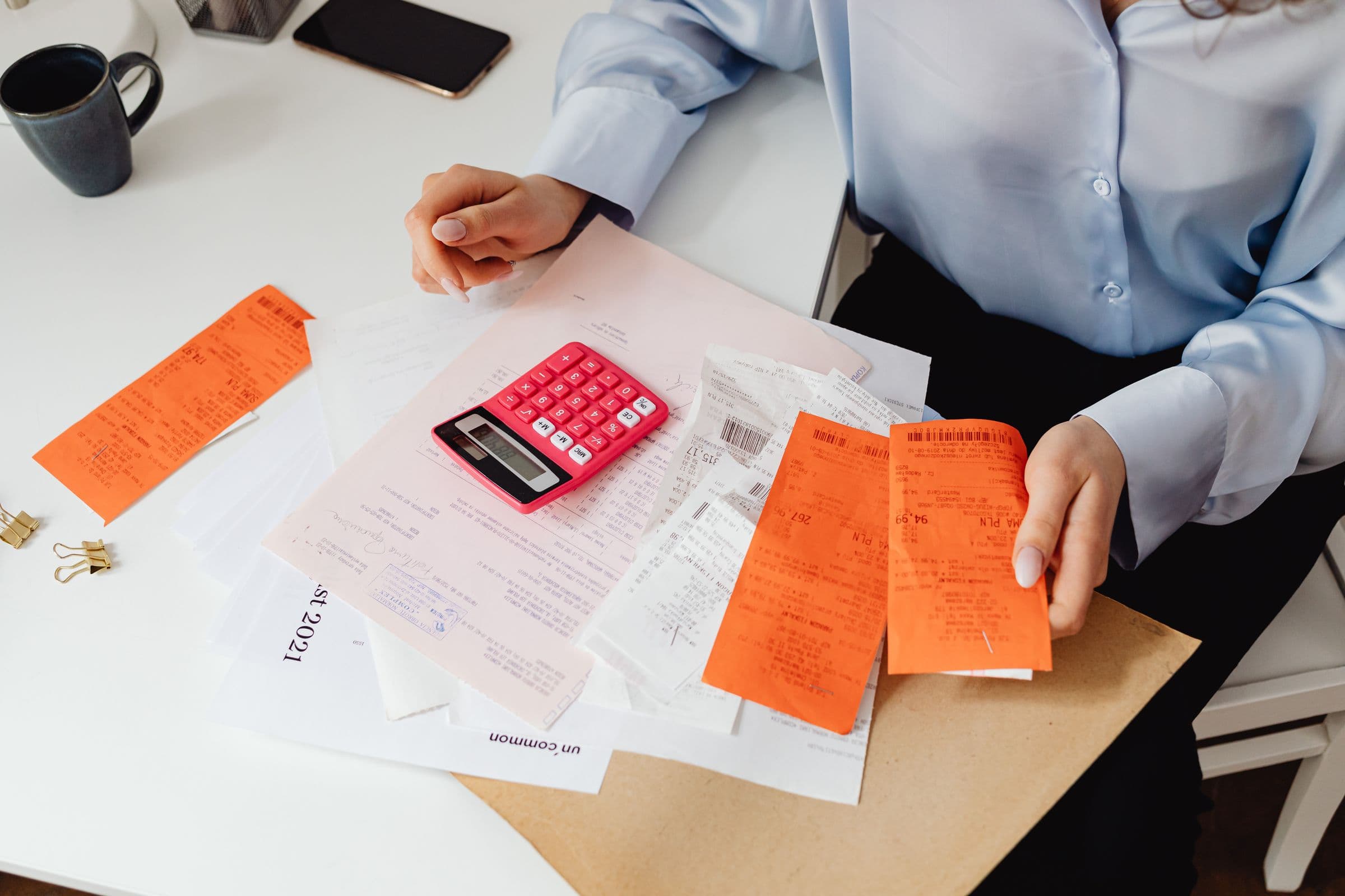 Receipts and a calculator on an accountant's desk