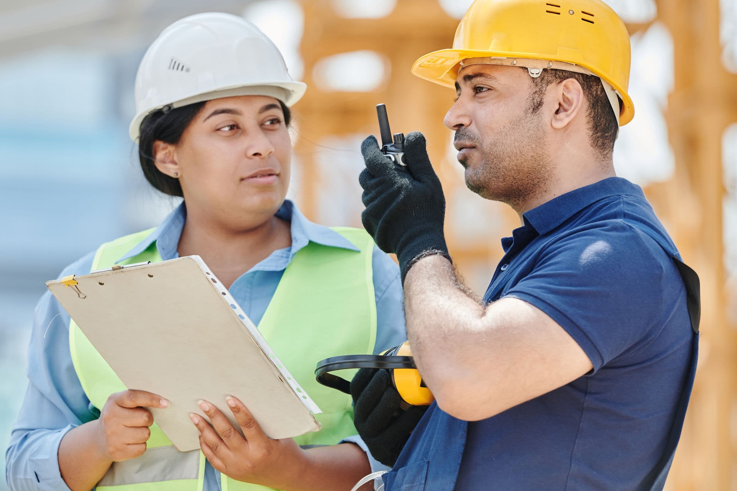 Construction workers in hard hats on site
