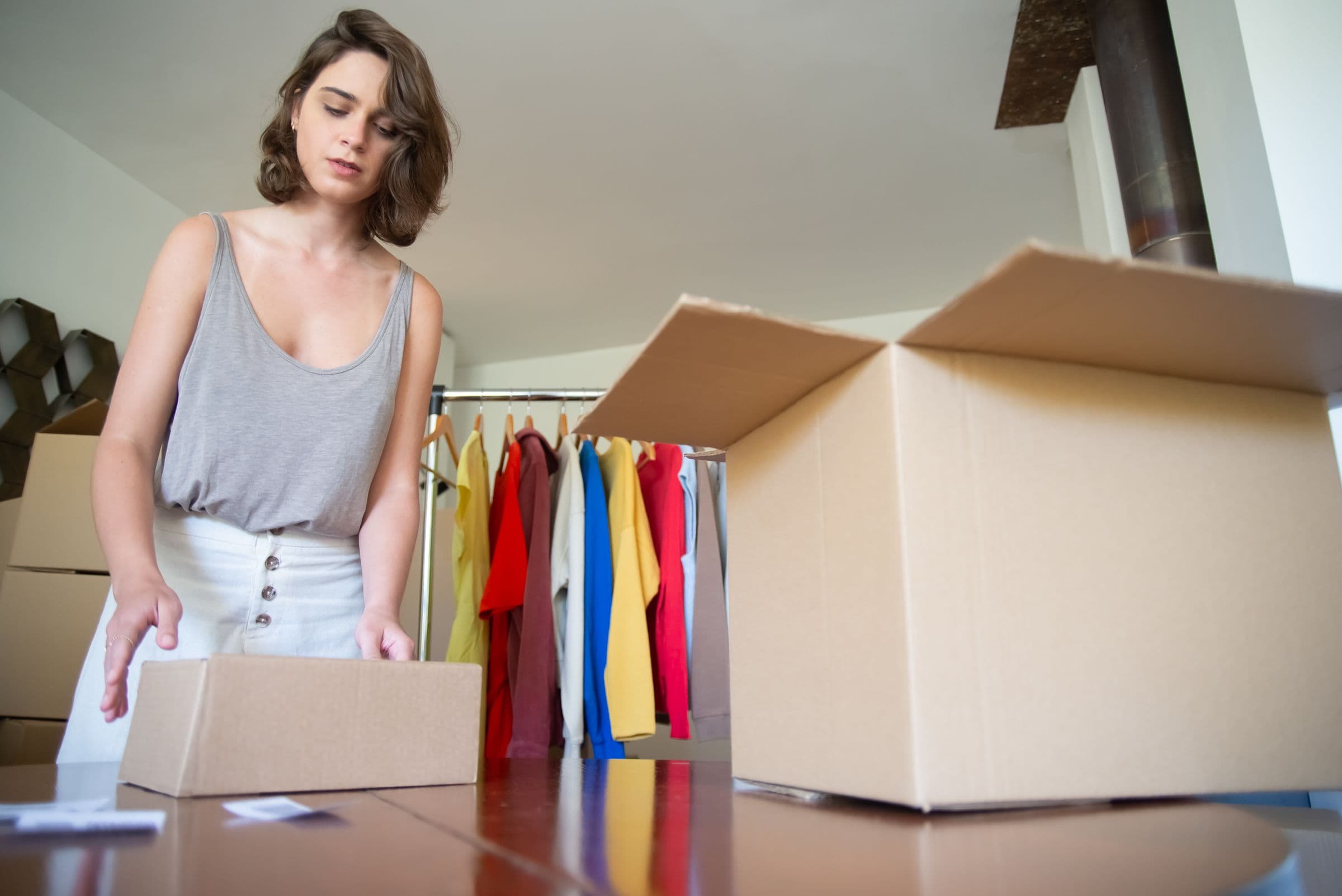 A small business owner packing an order